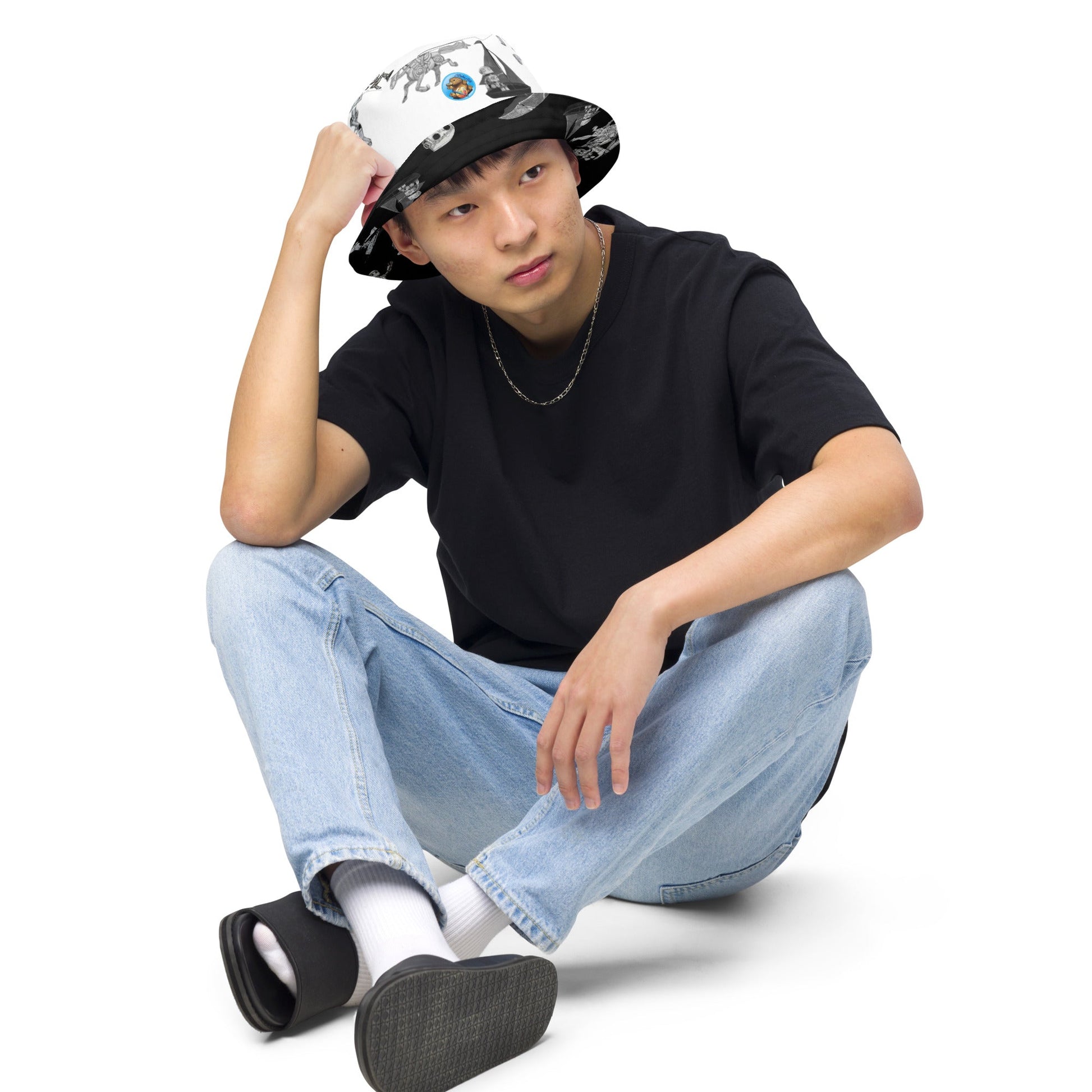 Reversible bucket hat with moisture-wicking fabric, featuring a versatile style for streetwear.
