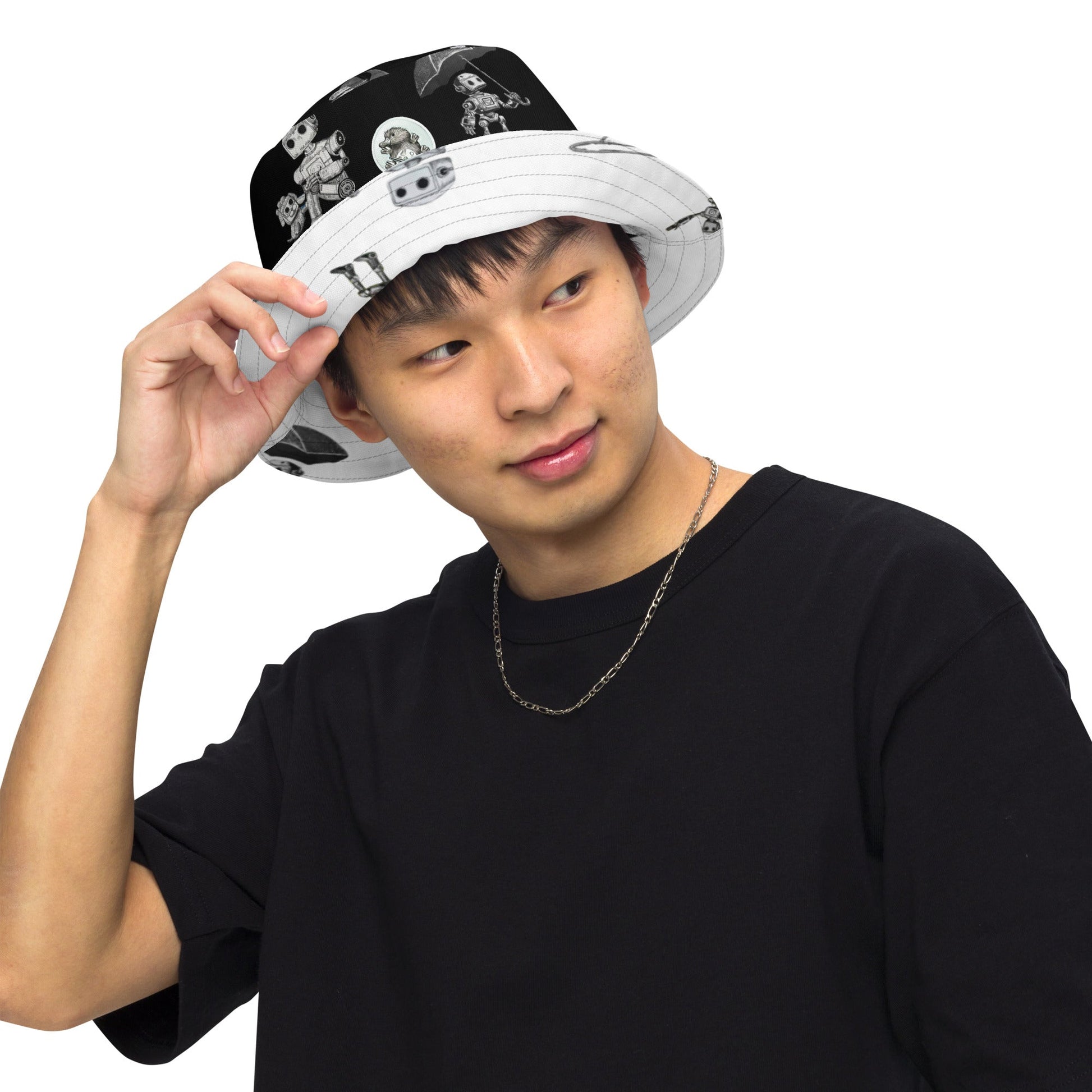Reversible moisture-wicking fabric bucket hat by Bolt Voltage worn by a model, showcasing its versatile style.