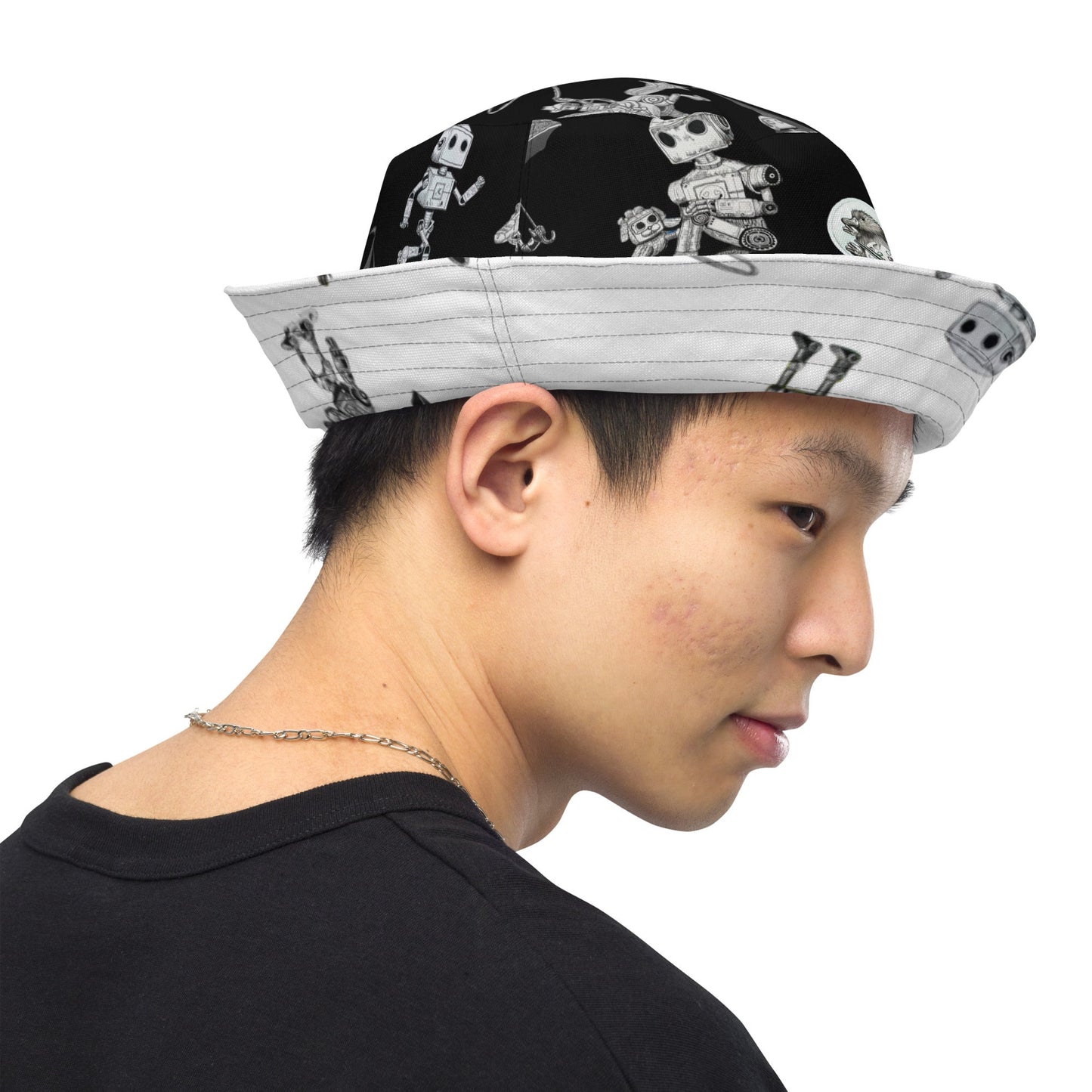 Reversible bucket hat with moisture-wicking fabric and robot design.