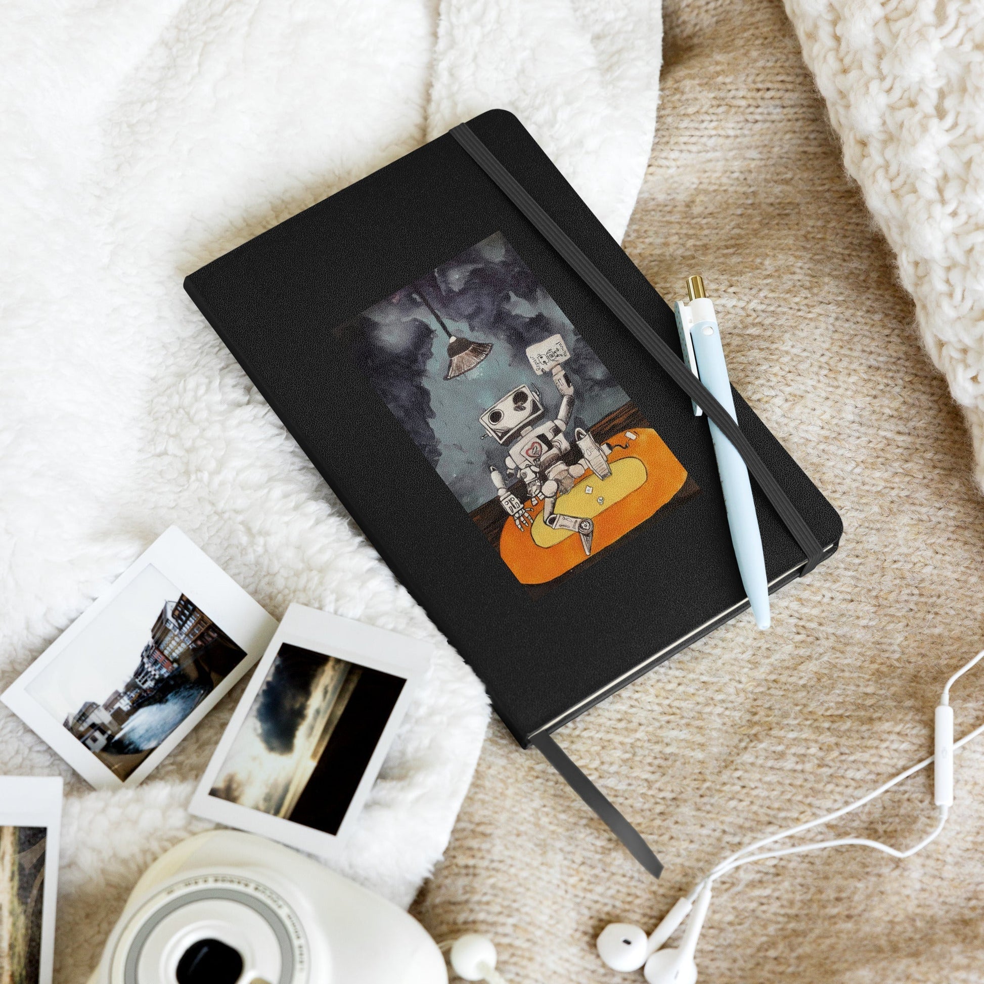 Hardcover notebook with elastic closure, ribbon marker, and expandable pocket, featuring lined cream pages.