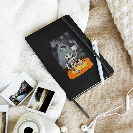 Hardcover notebook with elastic closure, ribbon marker, and expandable pocket, featuring lined cream pages.