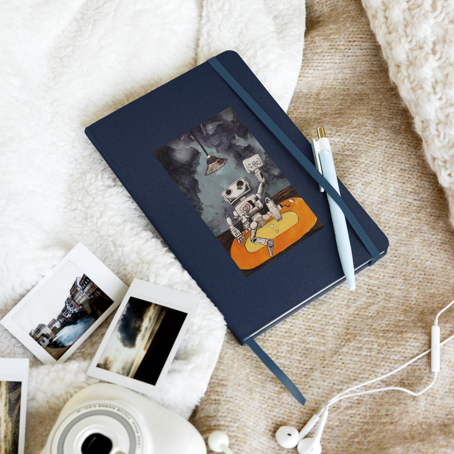 Hardcover notebook with elastic closure and ribbon marker, featuring 80 lined cream-colored pages and expandable inner pocket.
