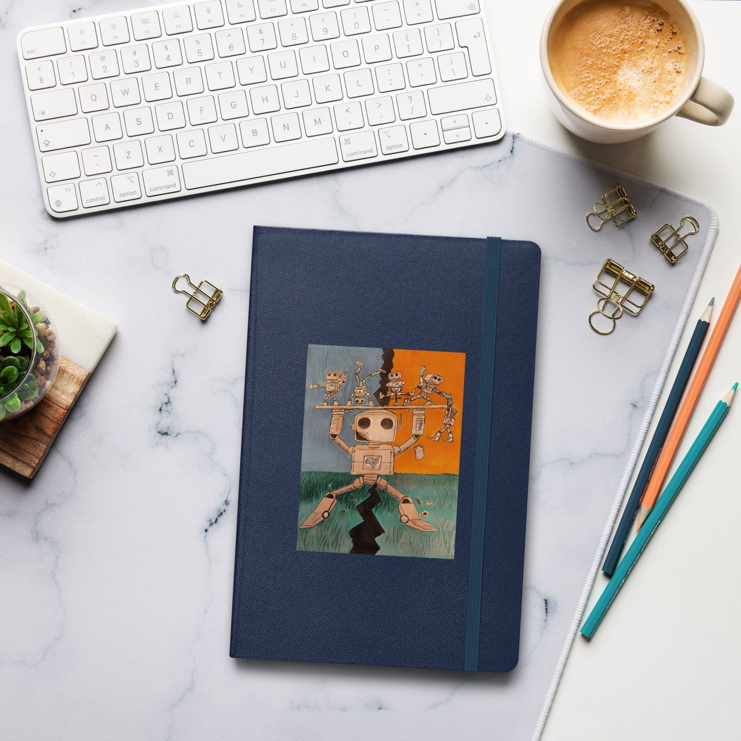 Hardcover bound journal with lined pages, elastic closure, and ribbon marker on a desk.