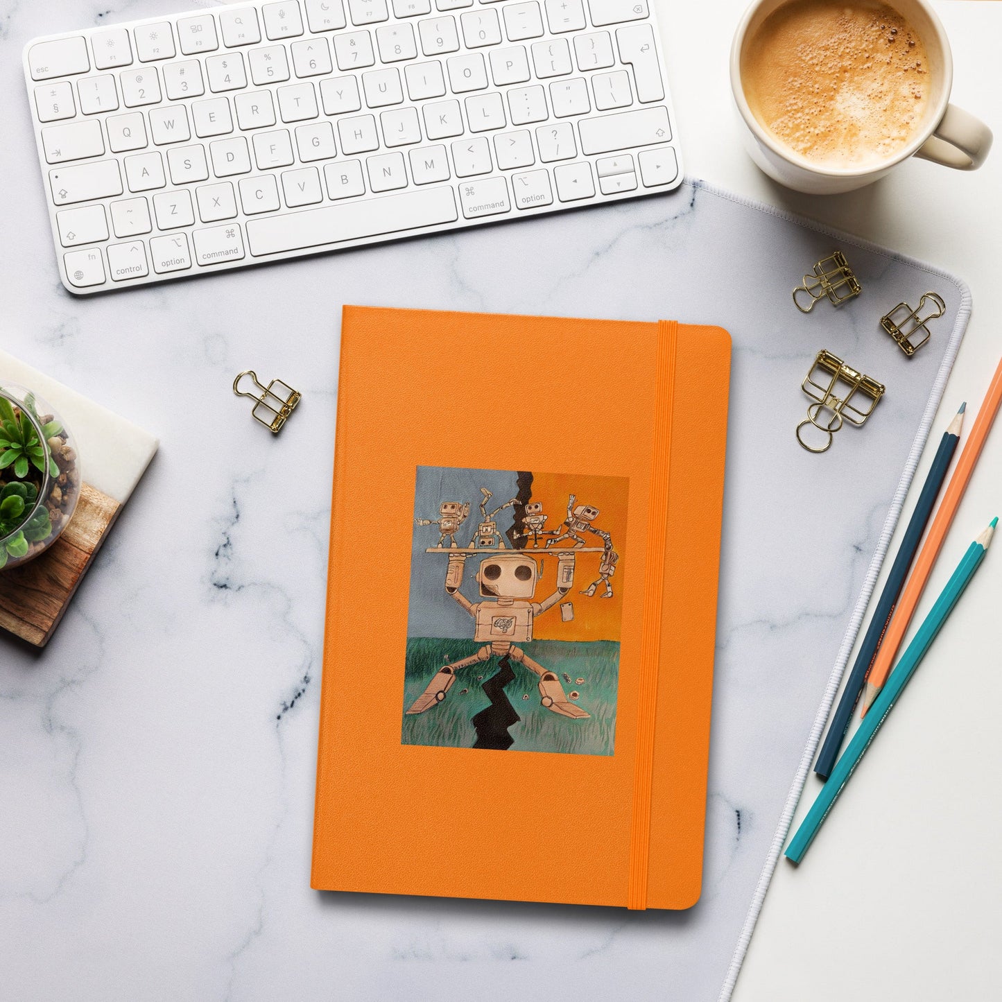 Hardcover bound journal with elastic closure and ribbon marker.