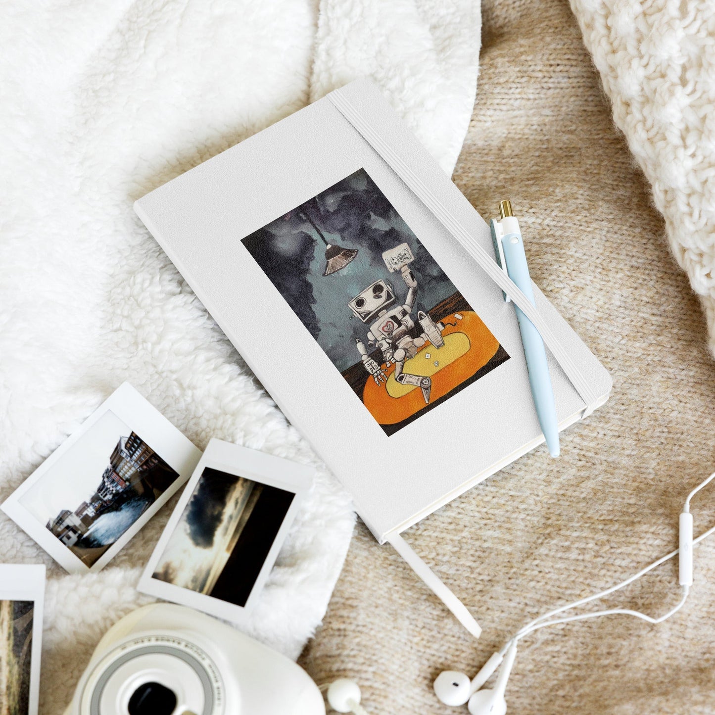 Hardcover notebook with elastic closure, ribbon marker, and expandable inner pocket.