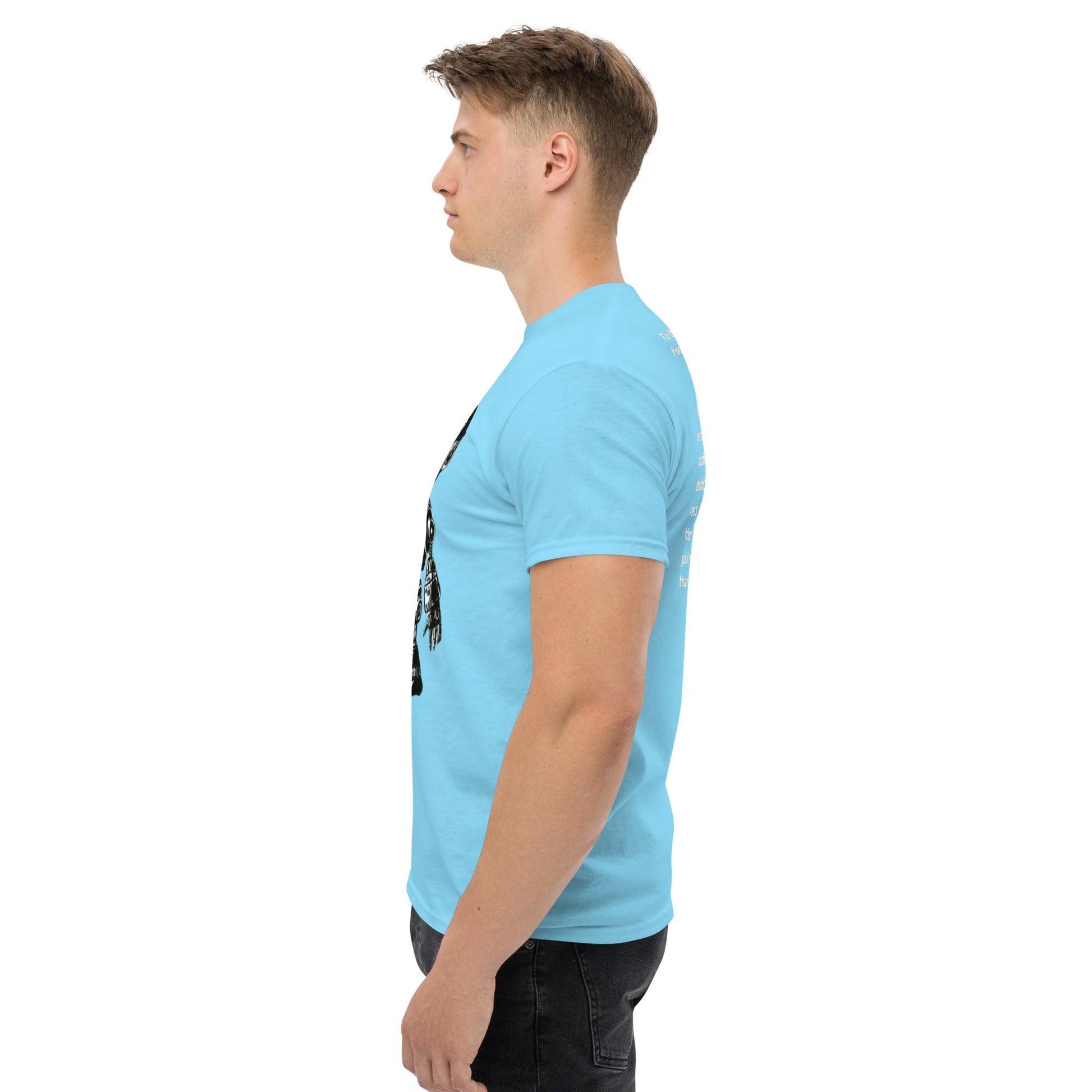 Side view of a man wearing a blue t-shirt with a futuristic design, emphasizing modern fashion and comfort.